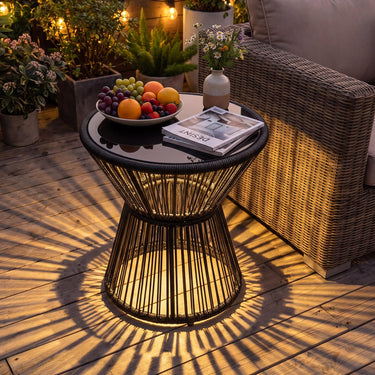 Outdoor Side Table with LED Warm Light, PE Rattan Hourglass-Shaped End Table with Tempered Glass Top